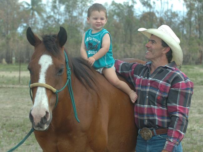 Australian Cowboy of the Year Ron Finch with soon-to-be-named steer wrestling Horse of the Year Oakey and son Dallon, 14 months.