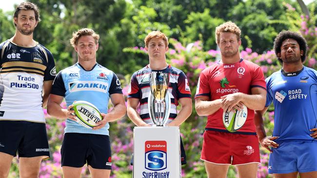 **FILE** A Monday, Feb. 13, 2017 image reissued Monday, April 10, 2017 of Super Rugby captains (L to R) Sam Carter of the Brumbies, Michael Hooper of the Waratahs, Nic Stirzaker of the Rebels, James Slipper of the Reds and Tatafu Polota-Nau (sitting in for Matt Hodgson) of the Western Force posing for a photograph with the competition's trophy during the 2017 Super Rugby Media Launch event in Brisbane. The Western Force and Melbourne Rebels will learn within three days which of them is to be axed, Australian Rugby Union chairman Cameron Clyne says. It's part of a broader restructure of an unwieldy and unpopular Super Rugby competition format, which is to be slashed from 18 teams to 15 after this season, with two South African sides also to go. (AAP Image/Dan Peled) NO ARCHIVING