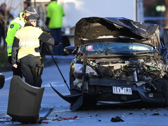 Police investigate a car accident at the scene of a brawl in Mater Street, Collingwood in Melbourne, Sunday, September 2, 2018. (AAP Image/Julian Smith) NO ARCHIVING