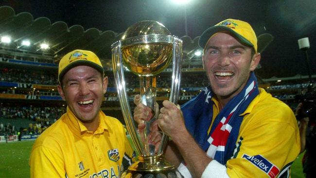 Ricky Ponting and Damien Martyn celebrate with the World Cup trophy.