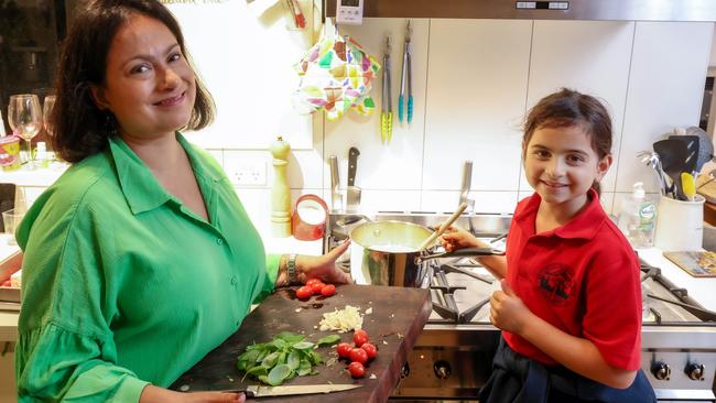 Pooja Magennis with her daughter, Anisha, 6. The Richmond family tries to shop smarter and minimise waste ‘as a way of life’. Picture: Ian Currie