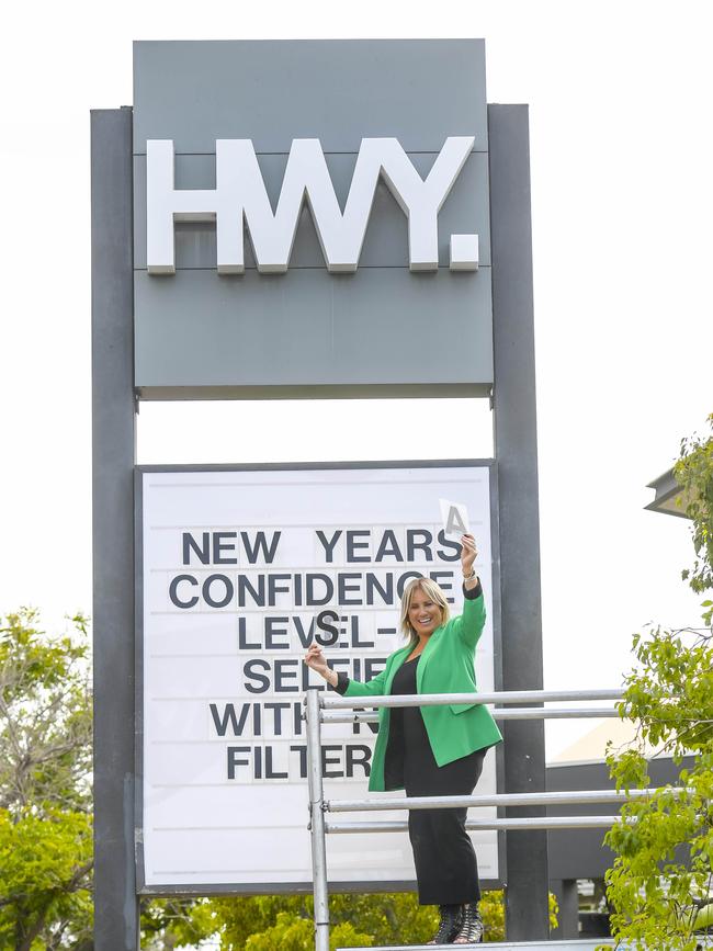 Christine with her New Year’s sign. Picture: RoyVPhotography