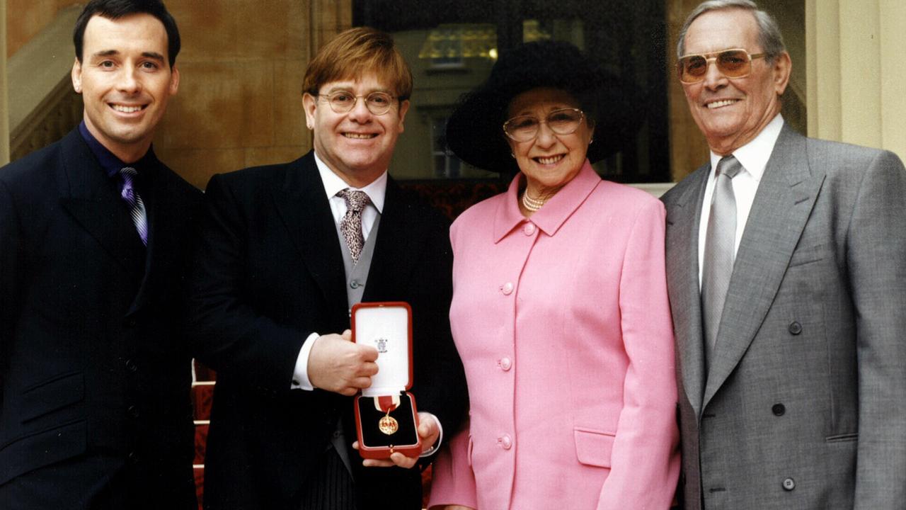 Elton John with his mother, stepfather Fred and partner David Furnish