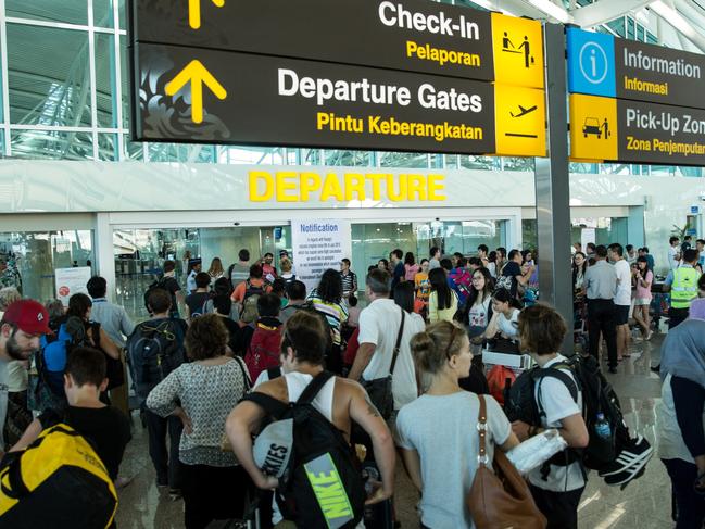 DENPASAR, BALI, INDONESIA - JULY 13:  Foreign tourists arrive at Ngurah Rai International airport departure on July 13, 2015 in Denpasar, Bali, Indonesia. Bali's international airport reopened after being closed due to volcanic ash clouds from Maunt Raung, but Australia's main carriers to the holiday destinations are still not flying. (Photo by Agung Parameswara/Getty Images)