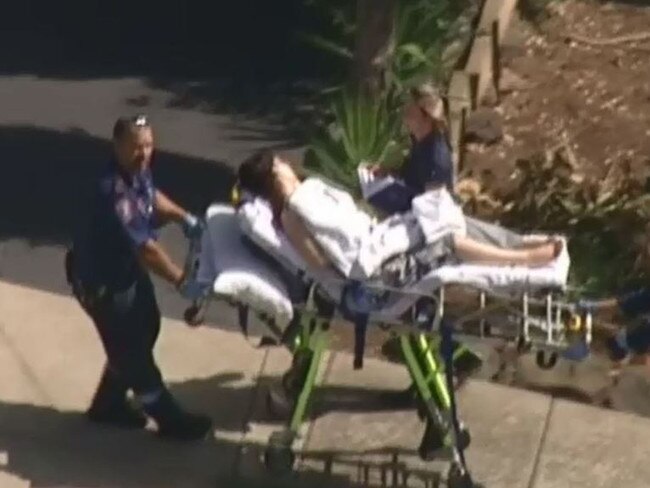 Kayla Witek, 18 at the time, is seen being wheeled by ambulance officers after suffering nine stab wounds from her former partner. Picture: Nine News