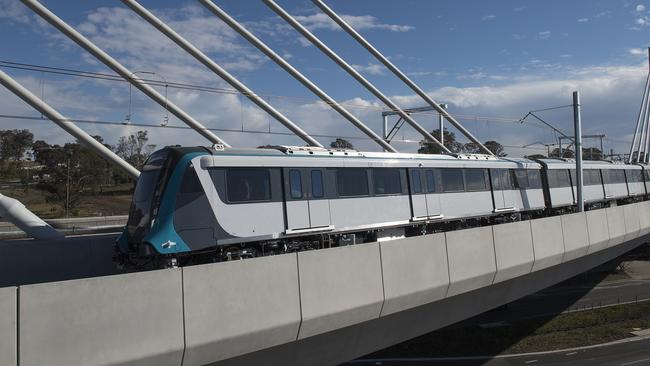 The driverless metro train crosses the Windsor Rd bridge.