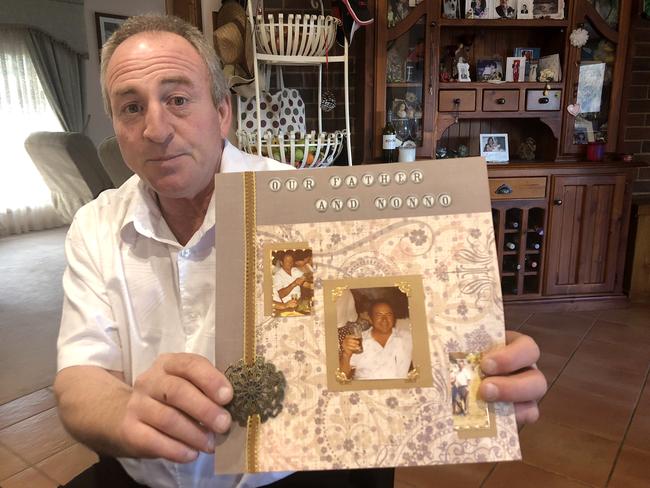 Vince Rotiroti holding photographs of his murdered father Salvatore Rotiroti. Picture: Keith Moor