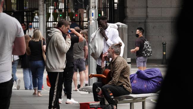 Homeless people near the corner of Elizabeth and Flinders streets in the CBD. Picture: Alex Coppel