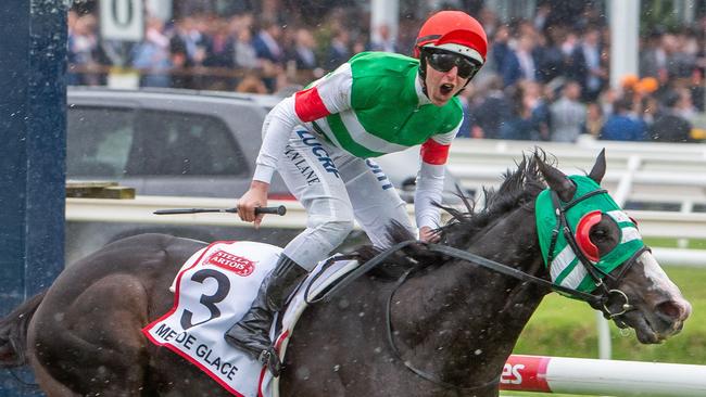 Damian Lane lets out a scream after winning the Caulfield Cup on Mer De Glace. Picture: Jay Town