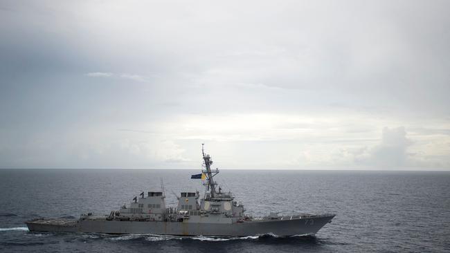 (FILES) In this file photo taken on October 21, 2016, the guided-missile destroyer USS Decatur (DDG 73) operates in the South China Sea as part of the Bonhomme Richard Expeditionary Strike Group (ESG). - An American warship has sailed through waters off the contested Spratly Islands in the South China Sea, in the latest implicit challenge to Beijing's sweeping territorial claims in the region, the Pentagon said Sunday, September 30, 2018. "Guided-missile destroyer USS Decatur conducted a freedom of navigation operation," an official told AFP. "Decatur sailed within 12 nautical miles of Gaven and Johnson reefs in the Spratly Islands." The official said all US military operations in the area "are designed in accordance with international law and demonstrate that the United States will fly, sail and operate wherever international law allows." The 12-mile distance is commonly accepted as constituting the territorial waters of a landmass.  Beijing claims all of the Spratly chain. There was no immediate reaction from China, but a similar US operation in July, involving the disputed Paracel islands, prompted a furious Beijing to deploy military vessels and fighter jets. (Photo by Petty Officer 2ndClass Diana QUINLAN / Navy Media Content Operations (N / AFP) / RESTRICTED TO EDITORIAL USE - MANDATORY CREDIT "AFP PHOTO / US NAVY/Petty Officer 2nd Class Diana Quinlan" - NO MARKETING NO ADVERTISING CAMPAIGNS - DISTRIBUTED AS A SERVICE TO CLIENTS