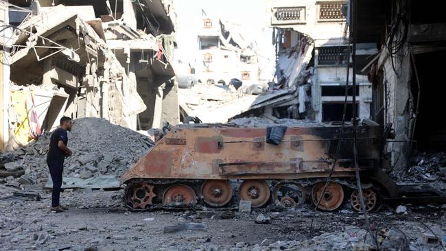 A destroyed Israeli military vehicle among the rubble in Gaza City. Picture: AFP