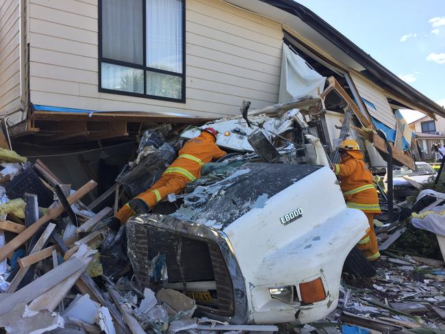 The truck driver and passenger were trapped in the cabin for nearly 30 minutes after it ploughed into a house at Carrickalinga. Picture: Gary Juleff