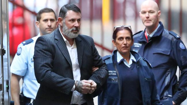 Karl Michael Hague is escorted from a prison van into the Supreme Court of Victoria in Melbourne, Friday, June 15, 2018. Picture: AAP Image/David Crosling