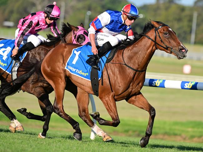 MELBOURNE, AUSTRALIA - JANUARY 10: Billy Egan riding Lang Park winning Race 8, the Sportsbet Jockey Watch Handicap, during Melbourne Racing at Sandown Hillside on January 10, 2024 in Melbourne, Australia. (Photo by Vince Caligiuri/Getty Images)