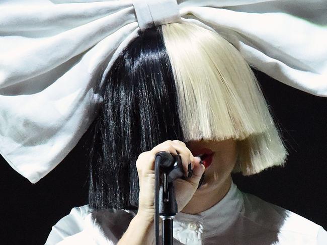 Singer Sia performs on stage during an Apple event at Bill Graham Civic Auditorium in San Francisco, California on September 07, 2016. / AFP PHOTO / Josh Edelson