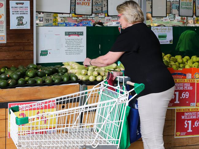 SYDNEY, AUSTRALIA -  Newswire Photos MARCH 14 2023 - A member of the public is seen buying produce and groceries in Sydney as the Cost of living continues to rise. Picture: NCA Newswire / Gaye Gerard.