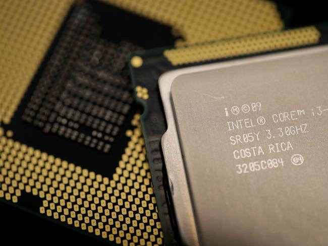 Computer processors by US technology company Intel are pictured on January 5, 2018 in Paris. As tech giants race against the clock to fix major security flaws in microprocessors, many users are wondering what lurks behind unsettling names like "Spectre" or "Meltdown" and what can be done about this latest IT scare. / AFP PHOTO / Thomas SAMSON