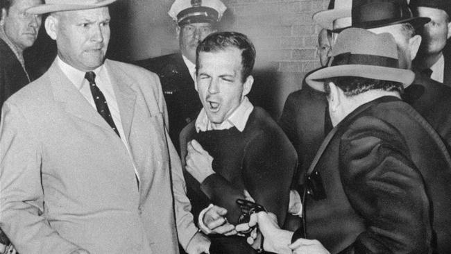 Lee Harvey Oswald is shot by nightclub owner Jack Ruby in Dallas police headquarters on November 24, 1963.