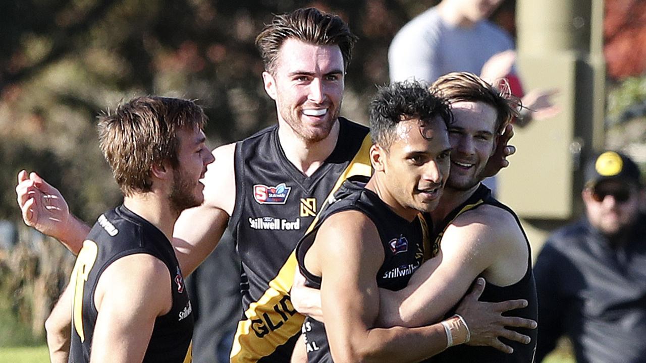 SANFL - Glenelg v North Adelaide at ACH Group Stadium. Marlon Motlop celebrates his goal with team mates. Picture SARAH REED