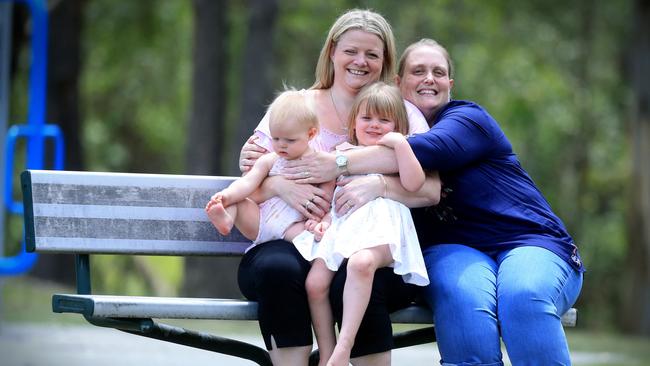 Selena Wool with her children Isabelle, 3, and Olivia, 1, and friend Kathryn Bauer, who carried them. Picture: Jamie Hanson