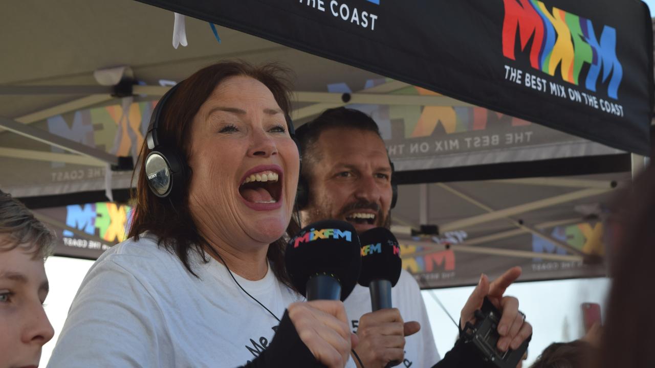 An emotional moment as 92.7 Mix FM breakfast announcers Caroline Hutchinson and Mark Darin discover they have smashed their $600,000 fundraising goal for the Give Me 5 for Kids appeal.