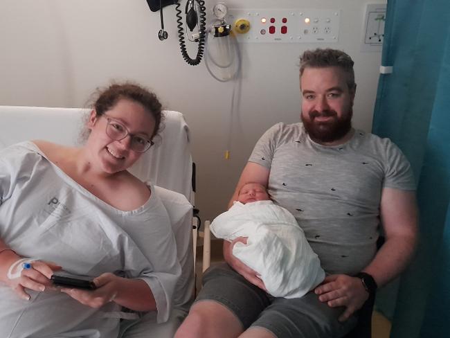 Imogen, her partner Michael and her first child Beau.