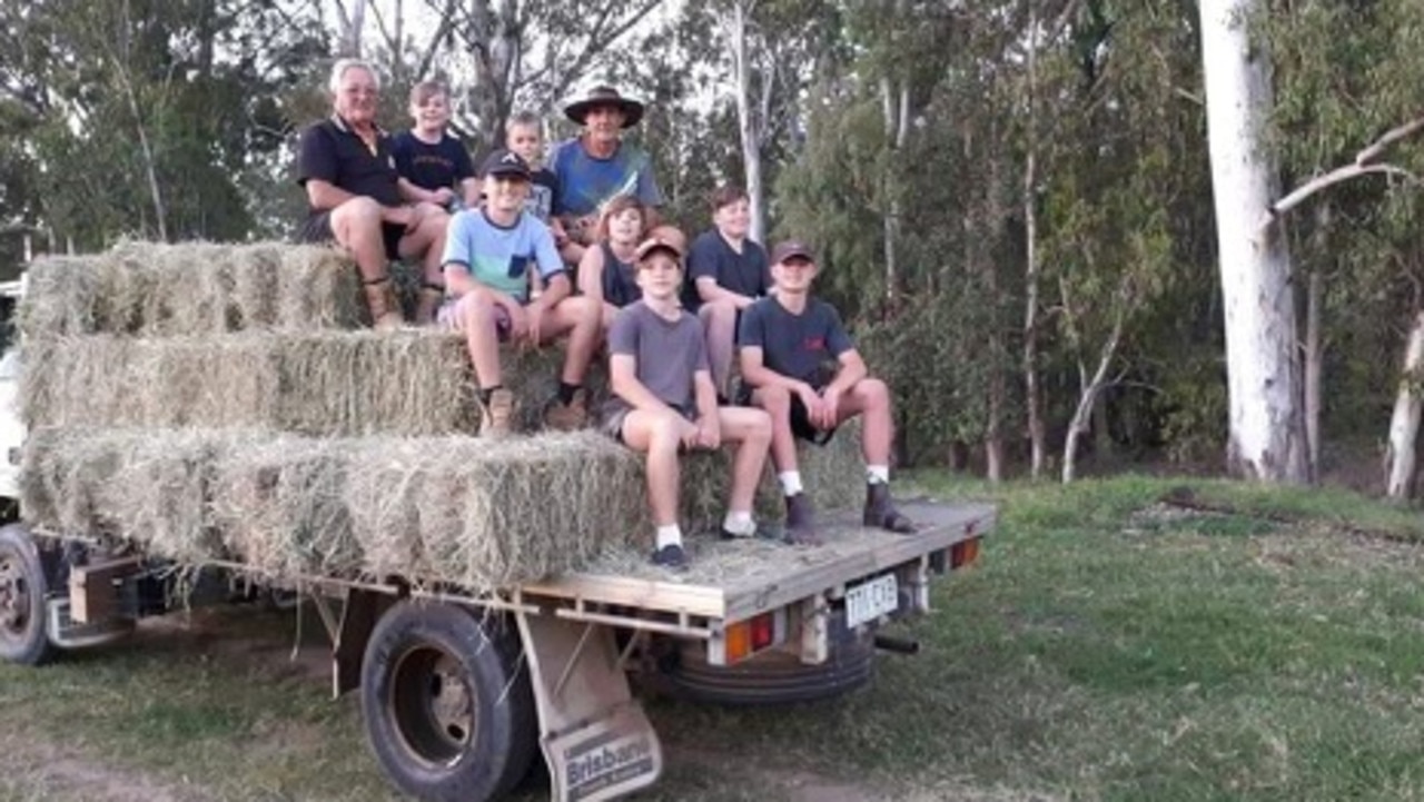 John and Eric Scott and some of their grandchildren on a hay truck at their beloved farm. Picture: Supplied