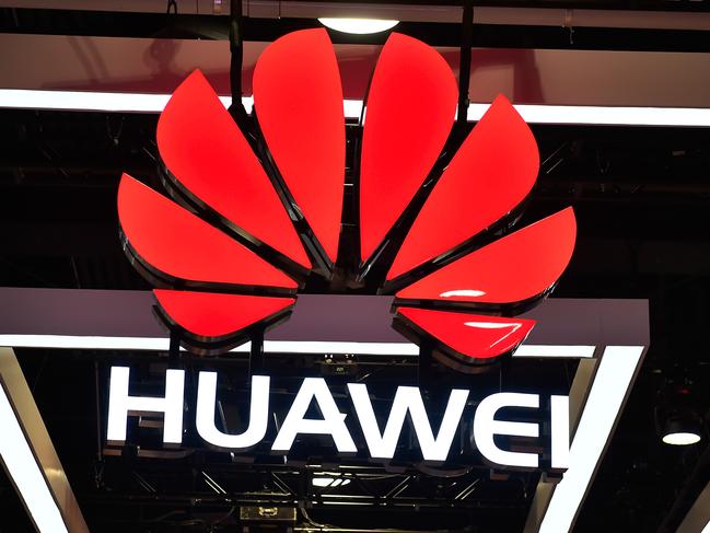 (FILES) In this file photo the Huawei logo is displayed during CES 2018 at the Las Vegas Convention Center on January 9, 2018 in Las Vegas, Nevada. - The Pentagon has published a list of 20 Chinese companies it says are backed by the military, in the latest instance of a running tit-for-tat economic battle between Washington and Beijing. Telecoms giant Huawei -- which has been dogged by allegations of stealing American trade secrets and aiding China's espionage efforts -- and video surveillance giant Hikvision are among the firms named in the list, according to Bloomberg reported June 24, 2020. (Photo by David Becker / GETTY IMAGES NORTH AMERICA / AFP)