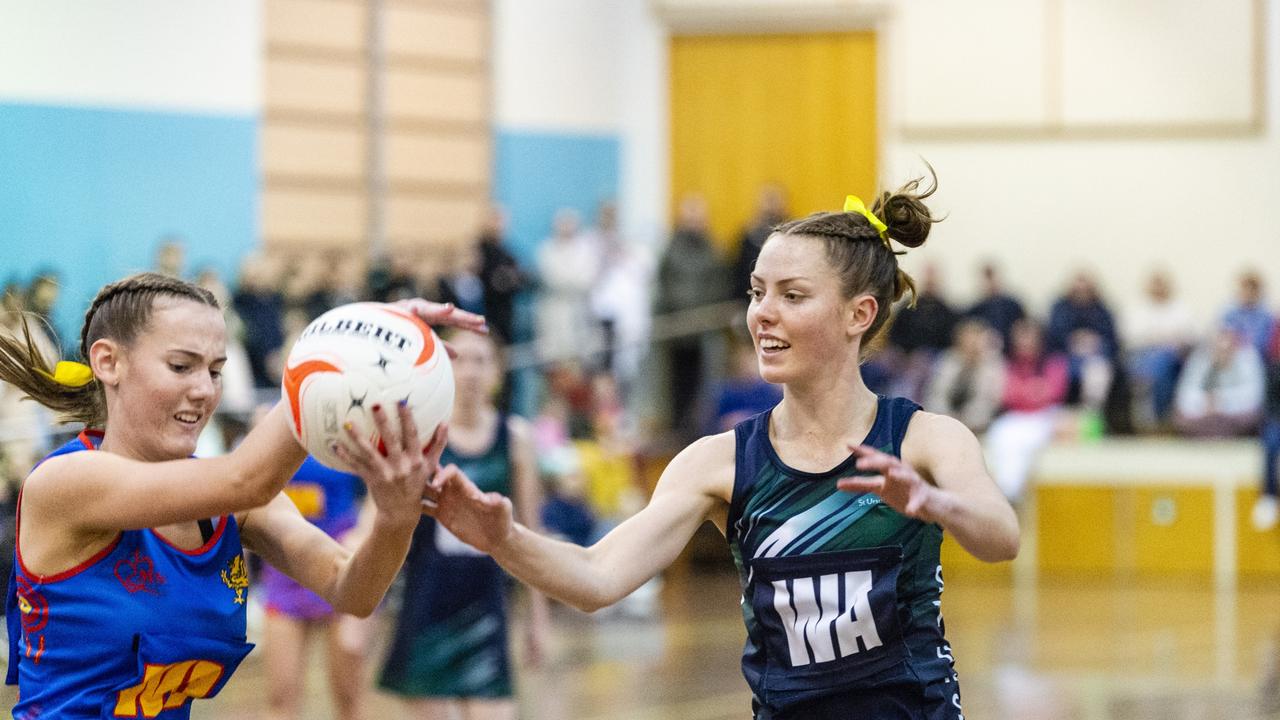 Molly Gore (left) of Downlands College competes for the ball with St Ursula’s Bridget Haynes in last year’s Merici-Chevalier Cup. Picture: Kevin Farmer