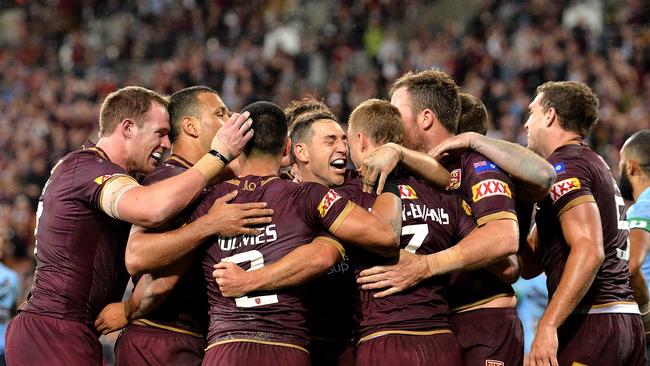 BRISBANE, AUSTRALIA - JULY 11: Billy Slater and teammates are seen celebrating after Daly Cherry-Evans of Queensland scores a try during game three of the State of Origin series between the Queensland Maroons and the New South Wales Blues at Suncorp Stadium on July 11, 2018 in Brisbane, Australia. (Photo by Bradley Kanaris/Getty Images)