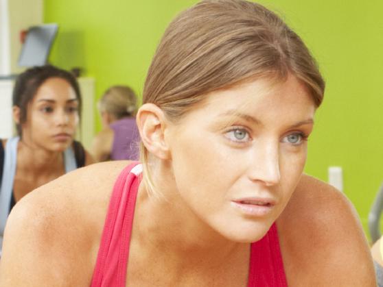 Women Taking Part In Gym Fitness Class