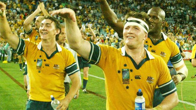 NOVEMBER 15, 2003 : Wallabies' (L-R) Mat Rogers, Elton Flatley and Wendell Sailor at Telstra Stadium in Sydney 15/11/03, following victory in Rugby World Cup (RWC) semi final Australia v New Zealand. Pic Mark Evans.Union