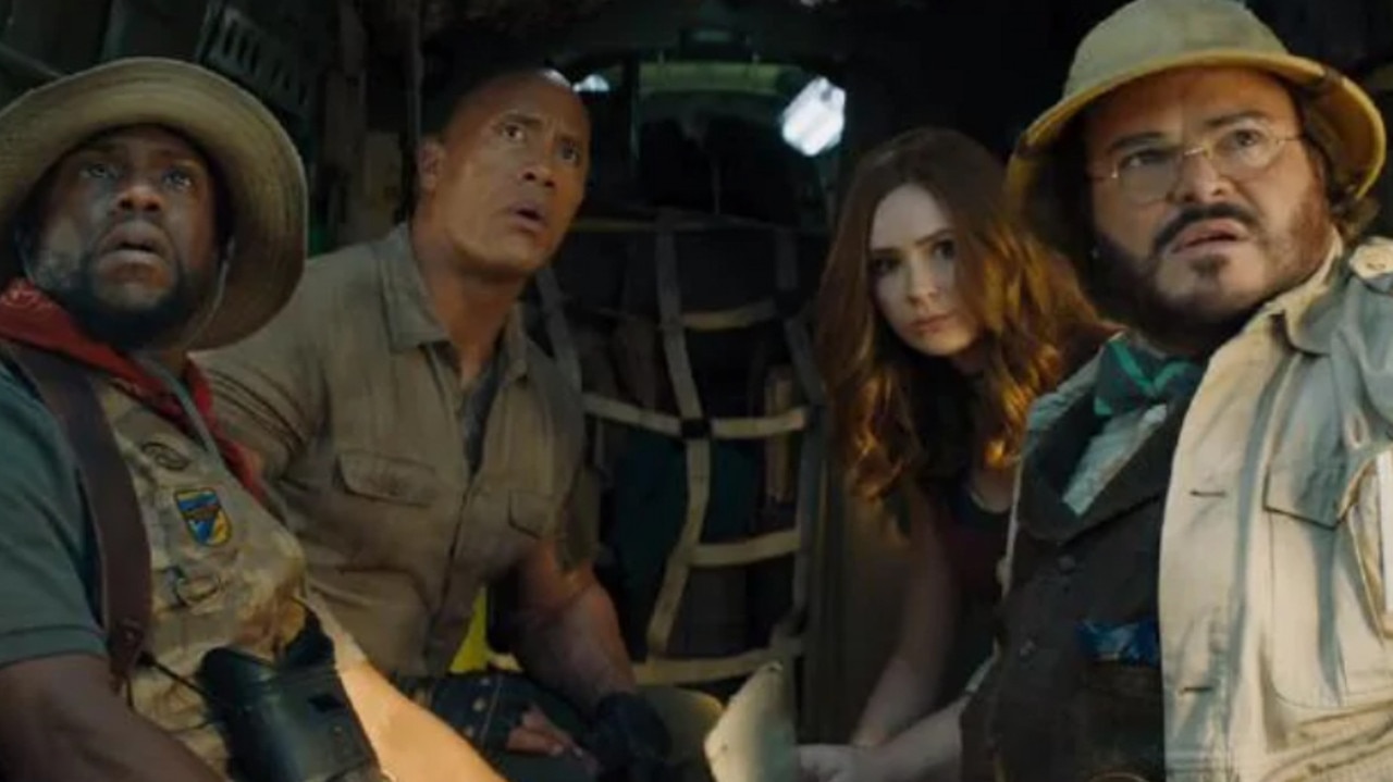 Kevin Hart, left, alongside actors Dwayne Johnson, Karen Gillen and Jack Black in a scene from his upcoming movie Jumanji: The Next Level.