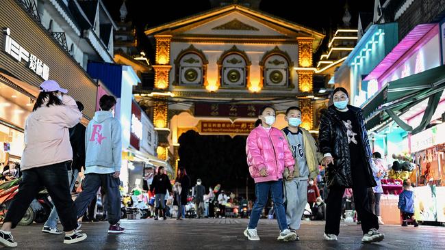 People at a night market in the city of Ruili in Dehong prefecture, in China’s west Yunnan Province. Picture: AFP)