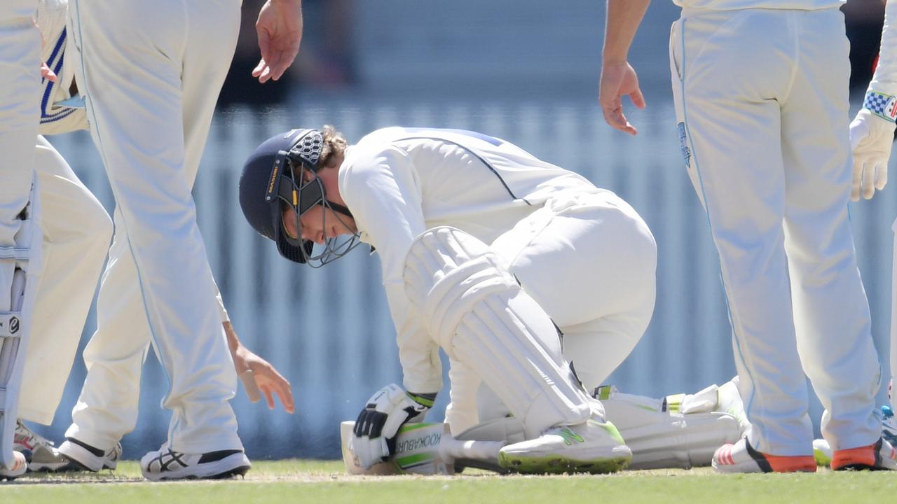Will Pucovski of Victoria is taken off injured after being hit by the ball during a Sheffield Shield game