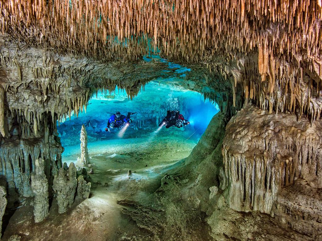 Underwater Photographer of the Year 2018. HIGHLY COMMENDED Category 1. Wide Angle Credit name: Herbert Meyrl/UPY 2018 Nationality: Germany. Location: Cenote Nariz, Yucatan, Mexico. “Cenote Nariz is the entrance to a large cave system in Yucatan. When I saw this perfect window opening into a large room ahead of us I signaled my team to stop. After mind mapping the spot I swam very cautiously through the window and placed 2 strobes in slave mode on either side behind the opening. Then I signaled my buddies to swim through the opening.”