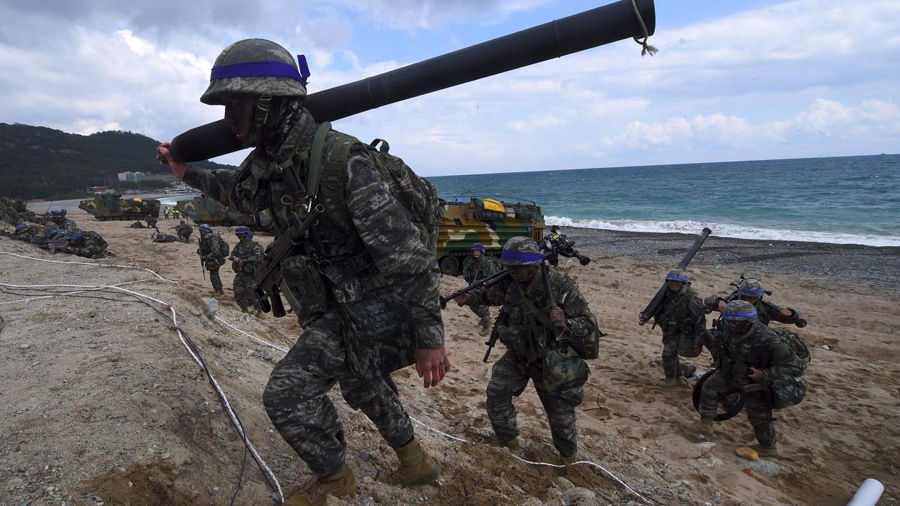 South Korean Marines moving into position on a beach during a joint landing operation by US and South Korean Marines in the southeastern port of Pohang. Picture: Jung Yeon-Je/AFP