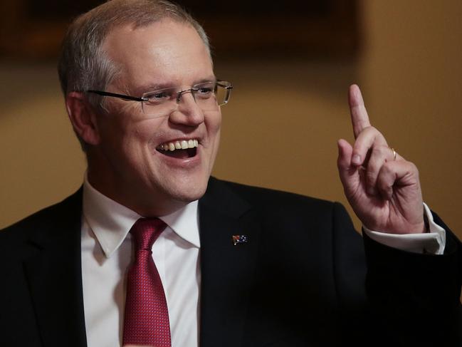 CANBERRA, AUSTRALIA - MAY 09:  Treasurer Scott Morrison speaks with comedian Peter Helliar in the budget lockup at Parliament House on May 9, 2017 in Canberra, Australia. The treasurer will identify key areas including using pre-income tax to assist first home buyers, details on the Western Sydney Airport and funding to assist with schools.  (Photo by Stefan Postles/Getty Images)