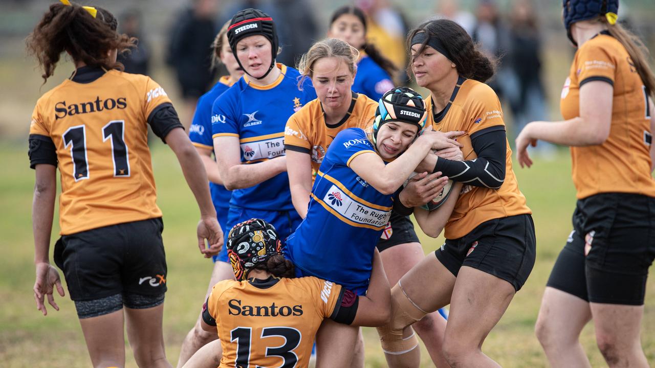 Sydney’s Georgia Wansey is tackled in the under 14s game. Picture: Julian Andrews