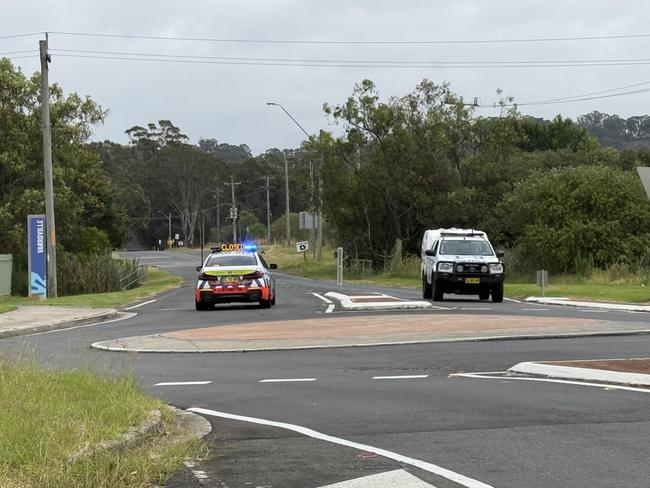 Highway patrol police car blocking St Andrews Rd, Varroville right outside Mount Carmel Catholic College.