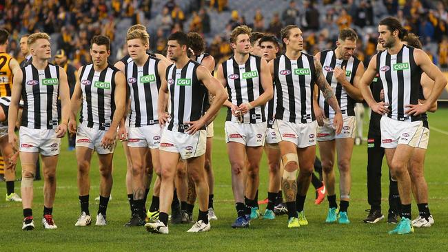 Collingwood players after the loss to Hawthorn.