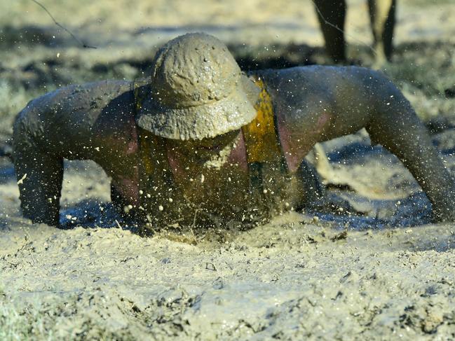 Barramuddy obstacle course challenge. Kris (correct) Famer hits the mud. Picture: Evan Morgan