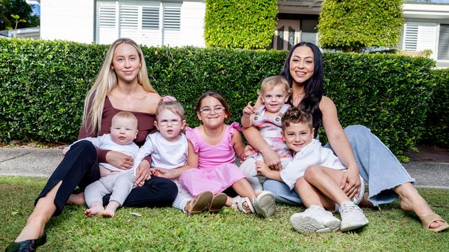 Amy Hembrow, left, with kids Jude Carmody, 6 months, and Aurora Carmody, 3, and Emilee Hembrow with kids Aaliyah Ada, 7, Giselle Ada, 1, and Jebrail Ada, 4. Picture: Luke Marsden.