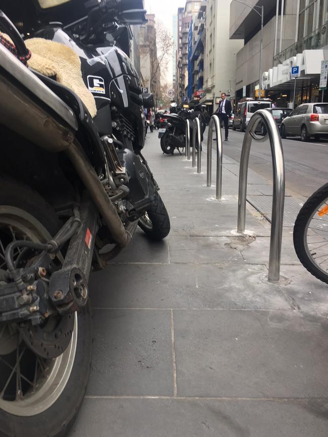 Motorcycles parked on Lt Collins St in Melbourne's CBD.