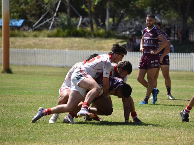 Rene Bagon is hit by the Dragons in the SG Ball Cup. Picture: Sean Teuma/NewsLocal