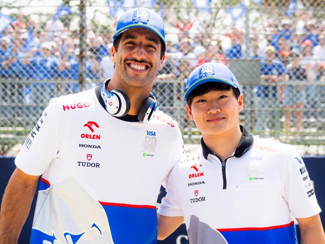 IMOLA, ITALY - MAY 19: Daniel Ricciardo of Australia and Visa Cash App RB and Yuki Tsunoda of Japan and Visa Cash App RB pose for a photo with the Visa Cash App RB grandstand on the drivers parade prior to the F1 Grand Prix of Emilia-Romagna at Autodromo Enzo e Dino Ferrari Circuit on May 19, 2024 in Imola, Italy. (Photo by Rudy Carezzevoli/Getty Images)