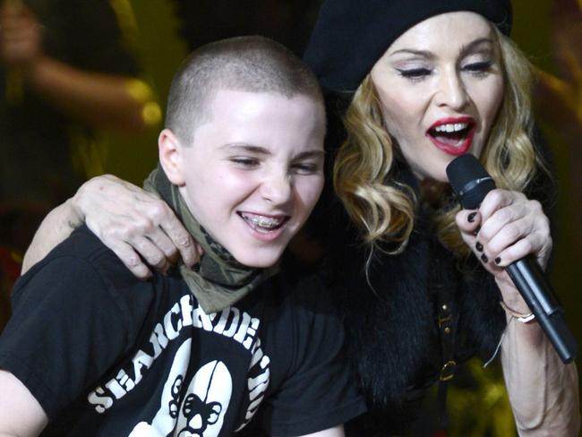 Happier times ... Rocco Ritchie and his mother Madonna perform on stage during her 