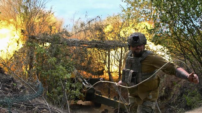 A Ukrainian artilleryman fires a 2A36 Giatsint-B field gun toward Russian positions near Avdiivka in the Donetsk region. Picture: AFP