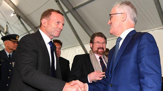 Malcolm Turnbull, right, and Tony Abbott, left, shake hands during the official opening of the Sir John Monash Centre at Villers-Bretonneux, last April.