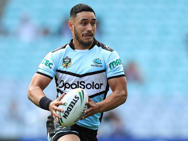 Cronulla's Valentine Holmes makes a break to set up a try by Cronulla's Sosaia Feki during the Cronulla Sharks v Bulldogs NRL match at ANZ Stadium, Homebush. Picture: Brett Costello